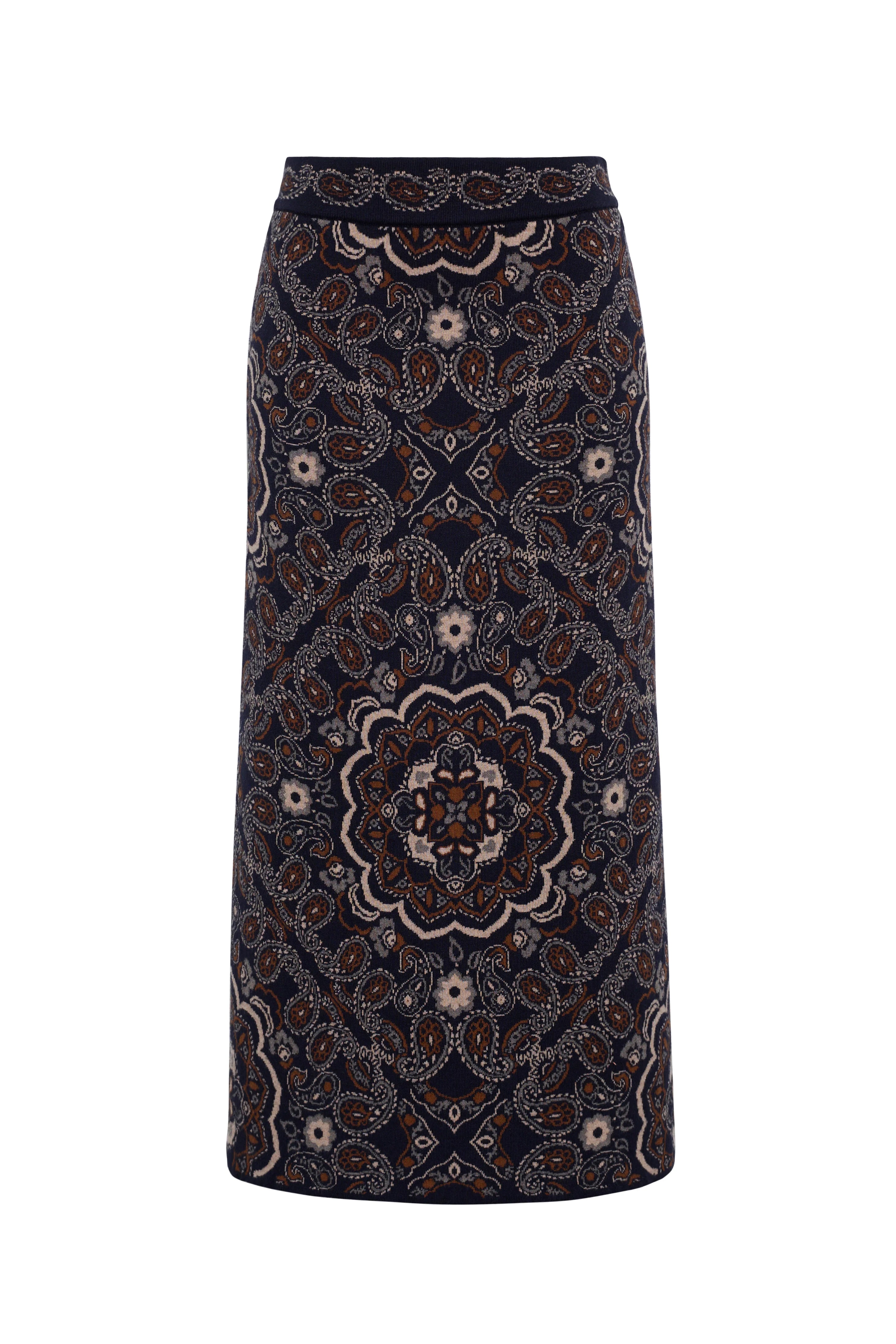 A dark navy midi skirt with an intricate paisley and mandala pattern in brown, beige, and white, shown against a plain white background.