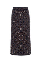 A dark navy midi skirt with an intricate paisley and mandala pattern in brown, beige, and white, shown against a plain white background.
