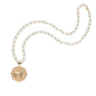 Gold necklace with a unicorn pendant on a white background