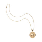 Gold necklace with a lion pendant on a white background