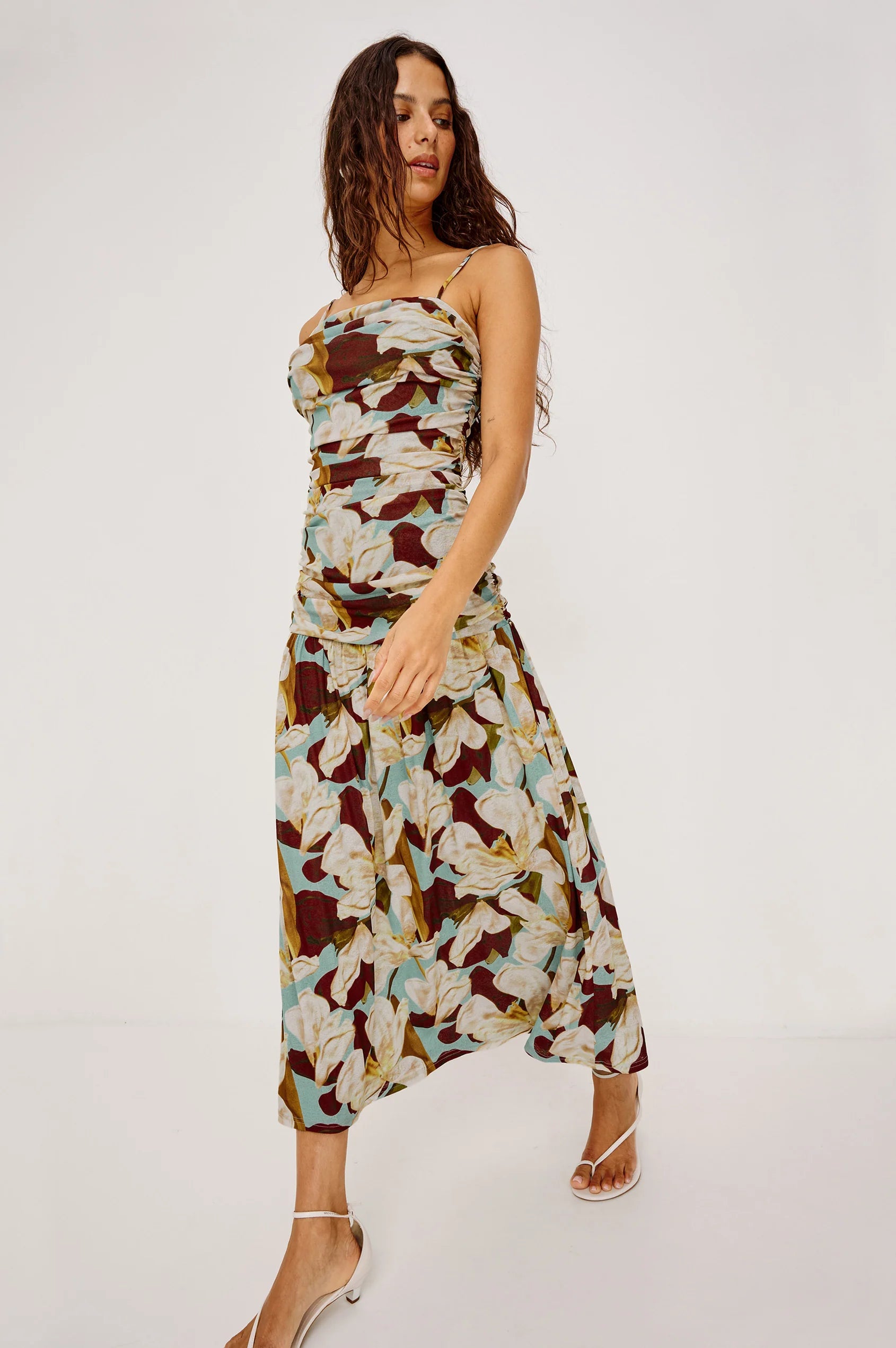 Woman wearing a floral dress on a white background