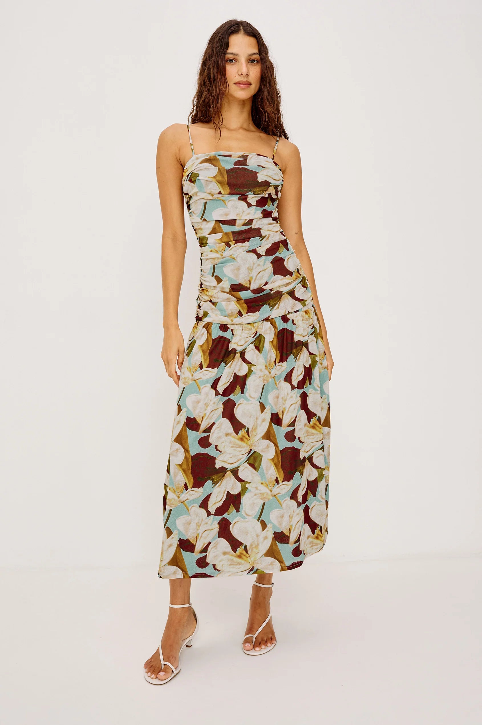 Woman wearing a floral dress on a white background