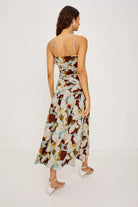 Woman wearing a floral dress on a white background
