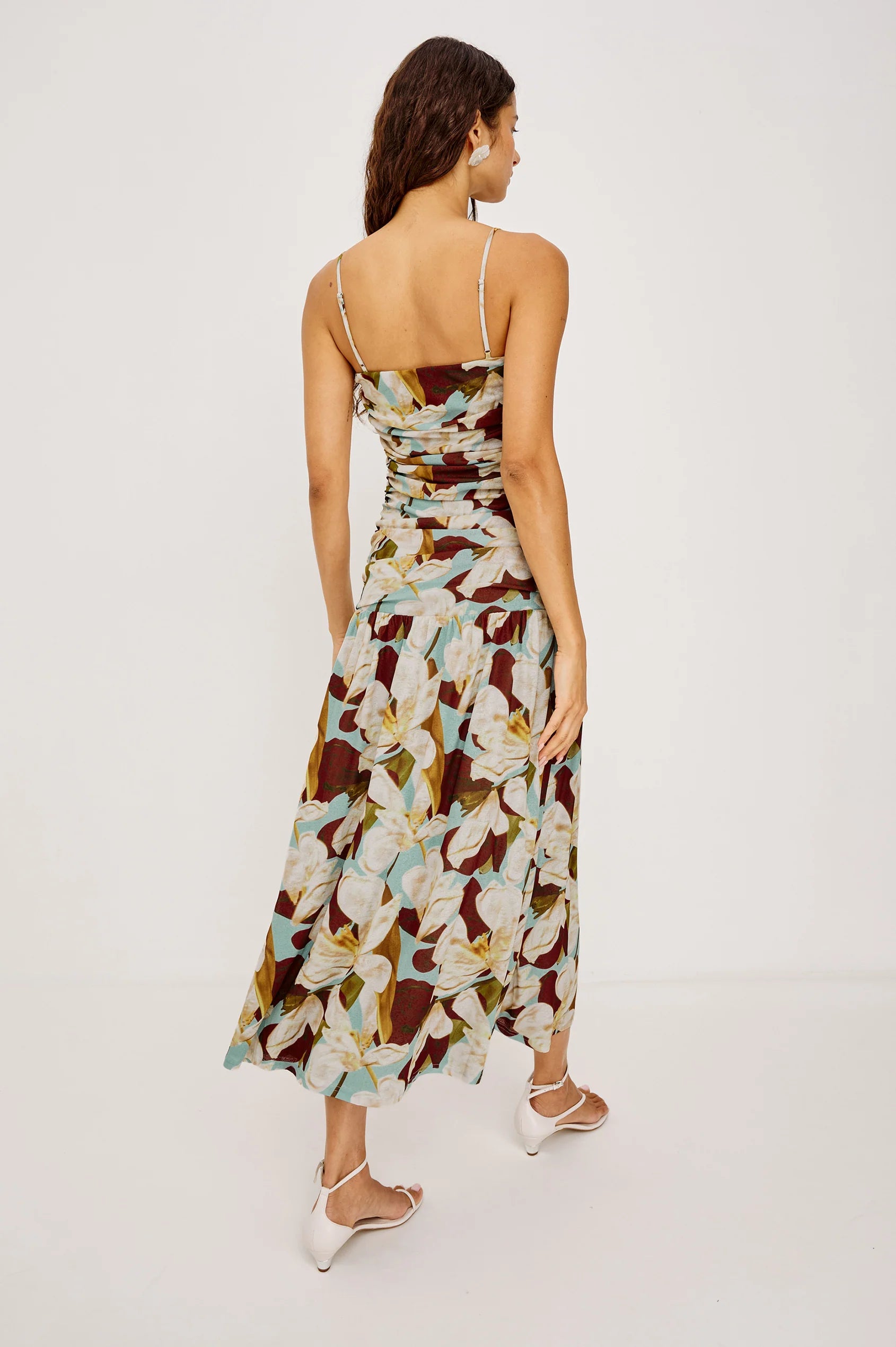 Woman wearing a floral dress on a white background
