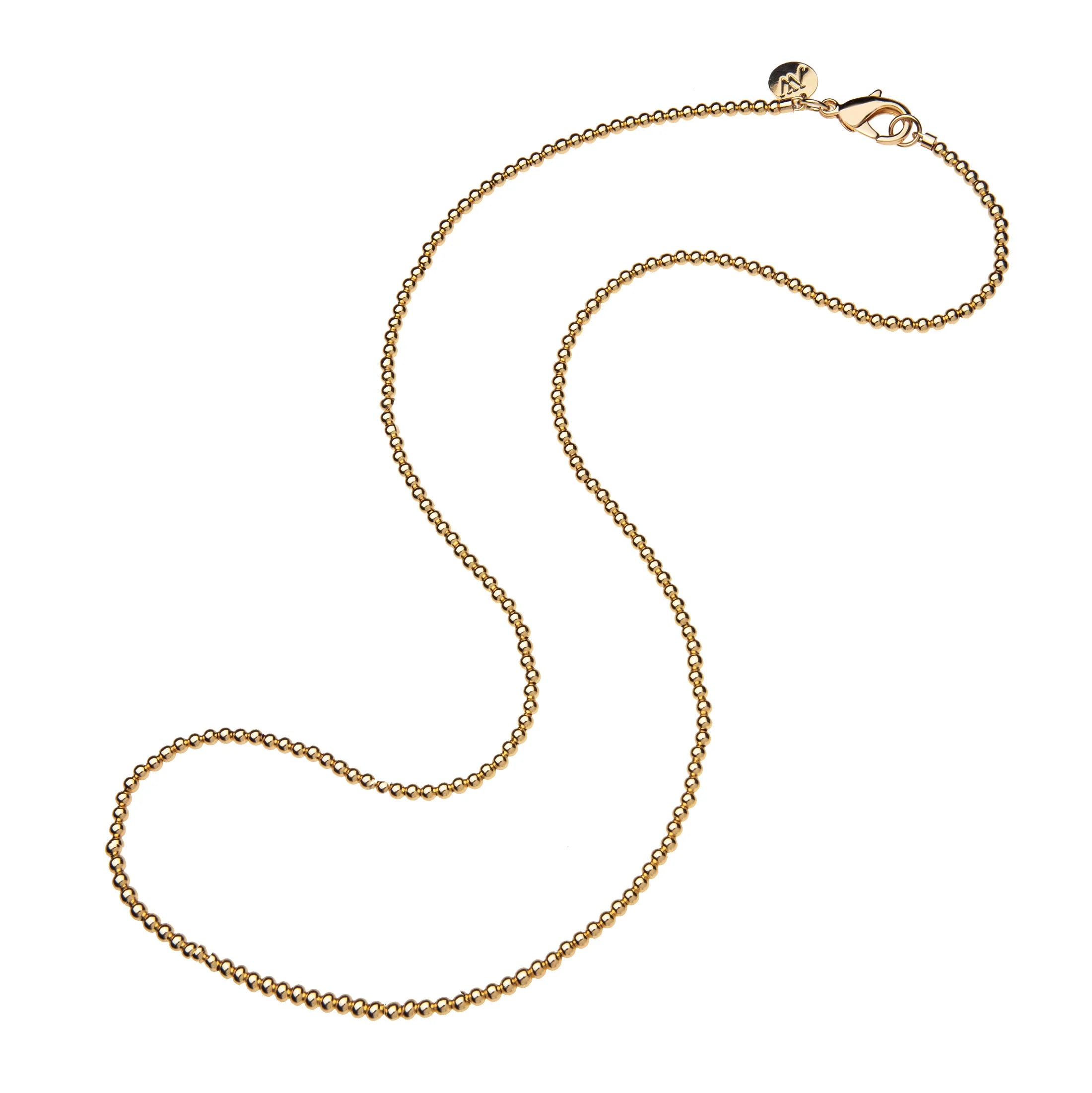 Gold chain necklace on a white background