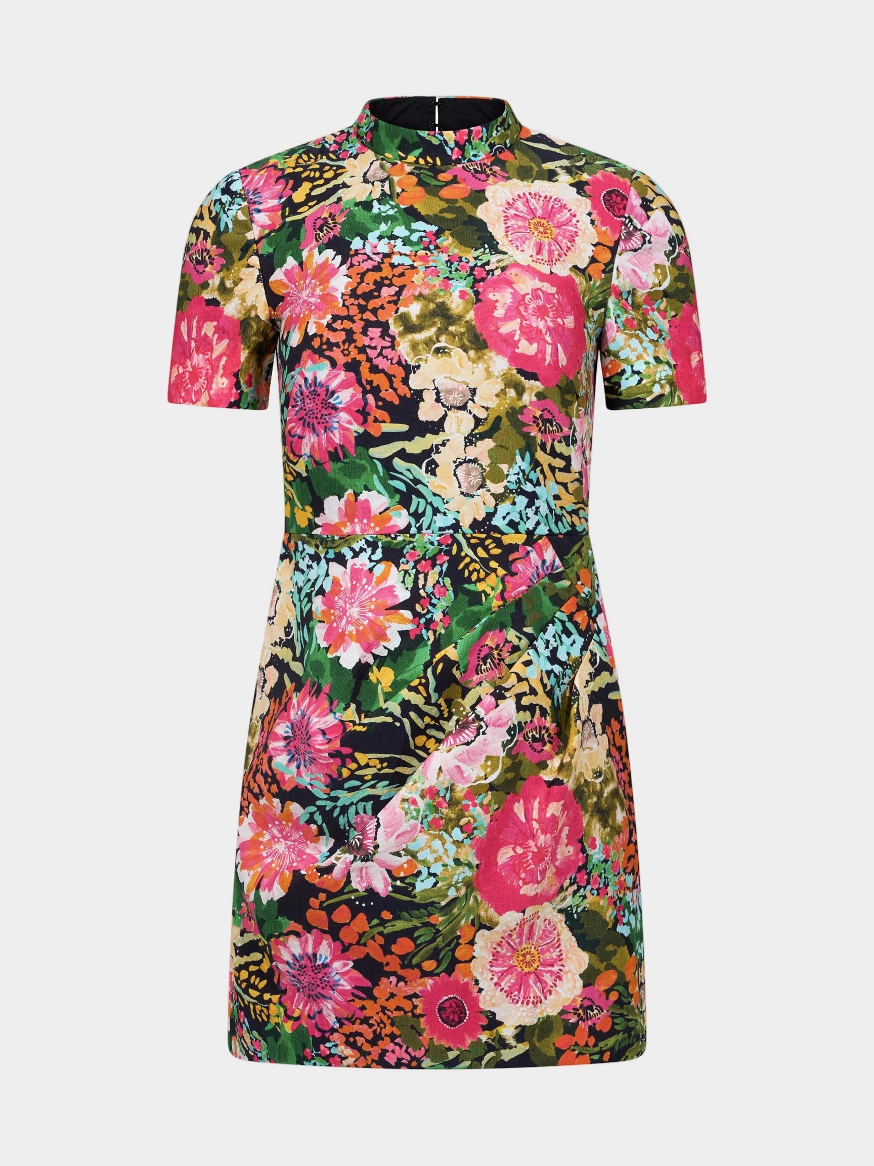 A short-sleeve mock-neck dress featuring a vibrant, dense floral print with pink, green, orange, and yellow flowers on a dark background, shown against a plain off-white studio backdrop.