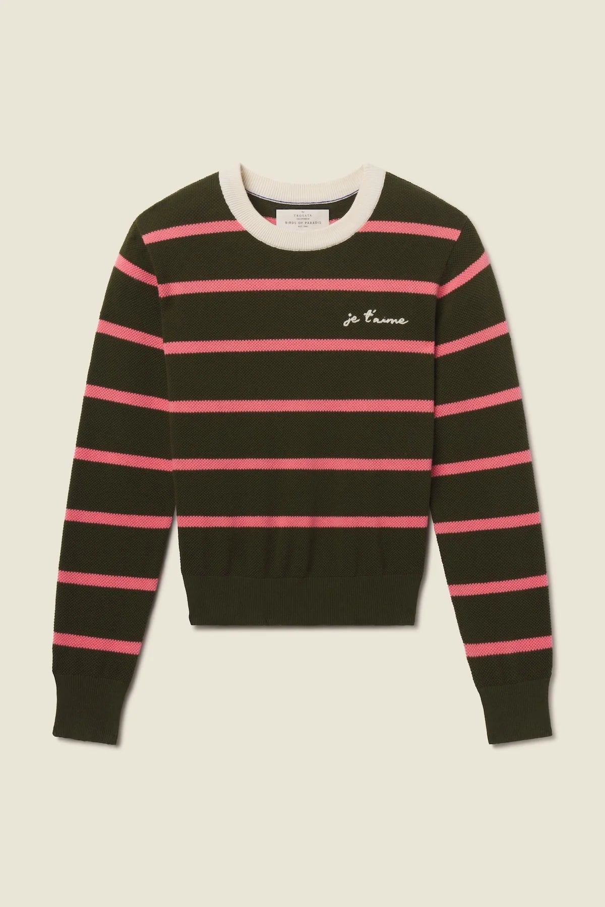 Black and pink striped sweater with a brand logo on a beige background