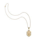 Gold necklace with a pendant on a white background