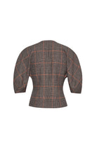 A cropped, structured blazer shown from the back, featuring a brown and gray houndstooth pattern with a thin orange windowpane check.
