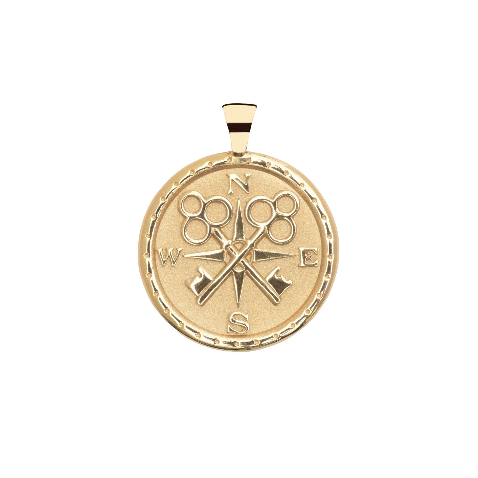 Gold compass pendant on a white background