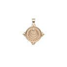Gold pendant with circular design on a white background