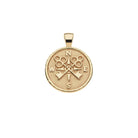 Gold compass pendant on a white background