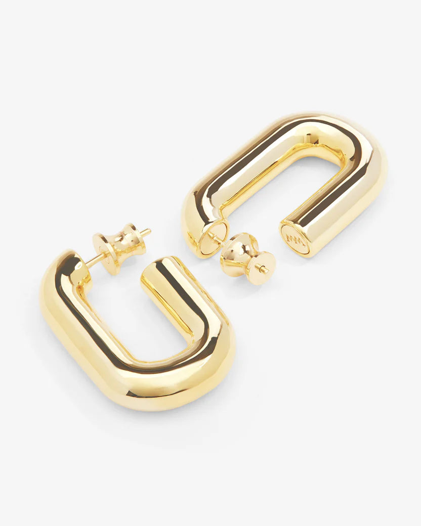 Gold hoop earrings on a white background