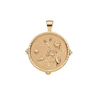 Gold pendant with astrological design on a white background