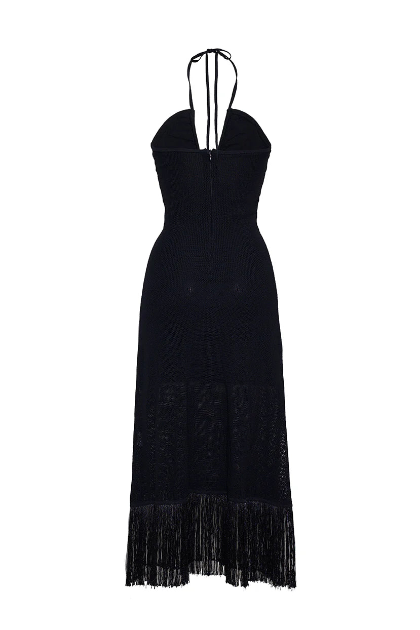 Black dress with fringe details on a white background