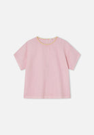 Pink blouse with yellow trim on a white background