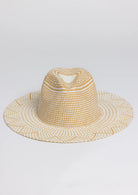Woven straw hat on a light gray background