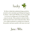 Text about optimism, luck, and a four-leaf clover pendant with Jane Win branding.