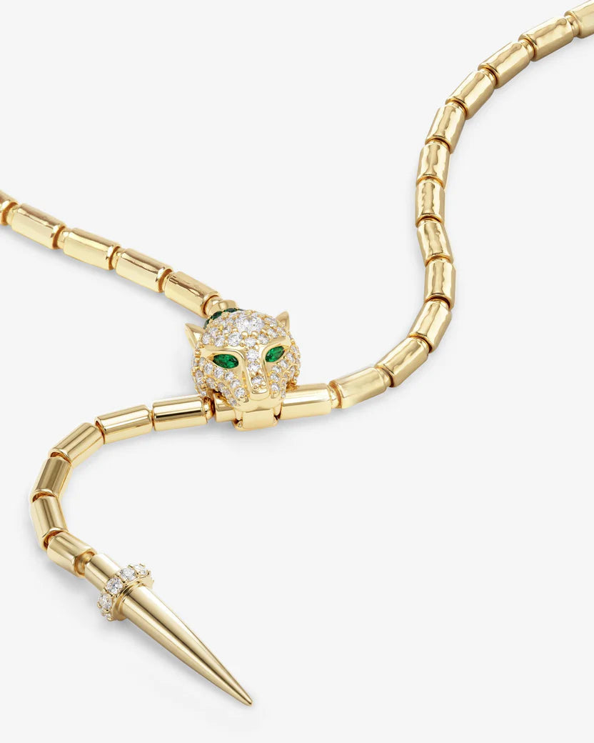 Gold necklace with panther head design on a white background