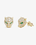 Gold panther-shaped earrings with green eyes on a white background