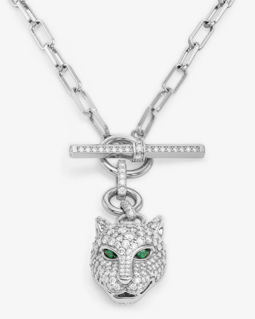 Silver necklace with a panther head pendant on a white background
