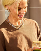 Woman wearing a necklace with a blurred background