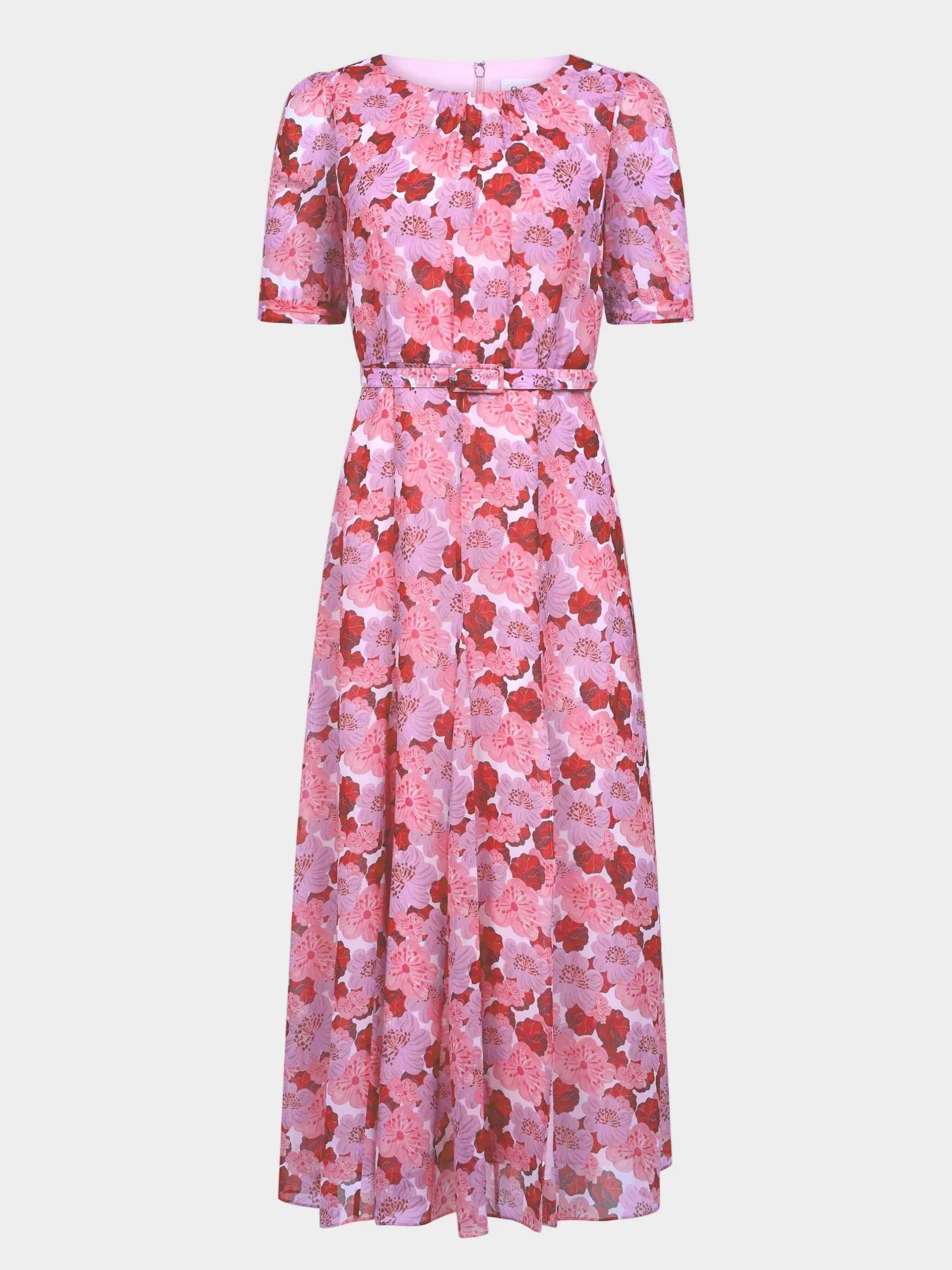 A pink floral midi dress with short puff sleeves, a round neckline, and a matching fabric tie belt at the waist, shown against a light gray background.