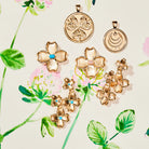 Gold floral earrings and pendants on a floral background