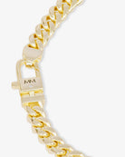 Gold chain bracelet with a clasp on a white background