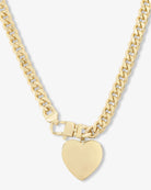 A gold-tone chain necklace with a heart-shaped pendant, displayed against a light gray background.