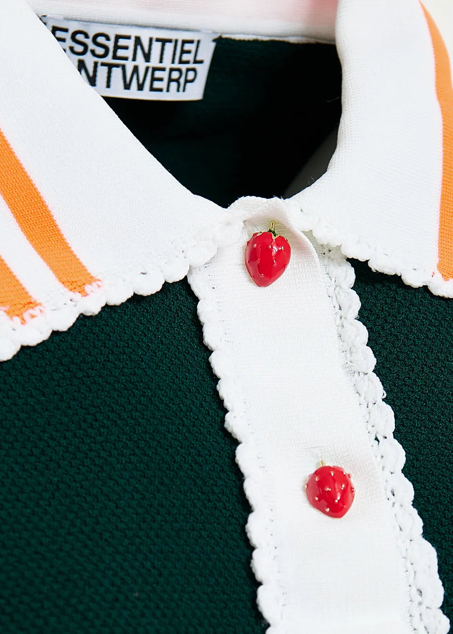 Close-up of a green polo shirt with orange stripes and red buttons, featuring the brand 'Essentiel Antwerp'.