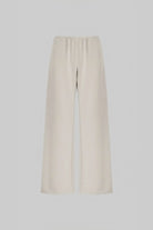 A pair of wide-leg cropped pants in a light cream or off-white color, displayed on a neutral light gray background.
