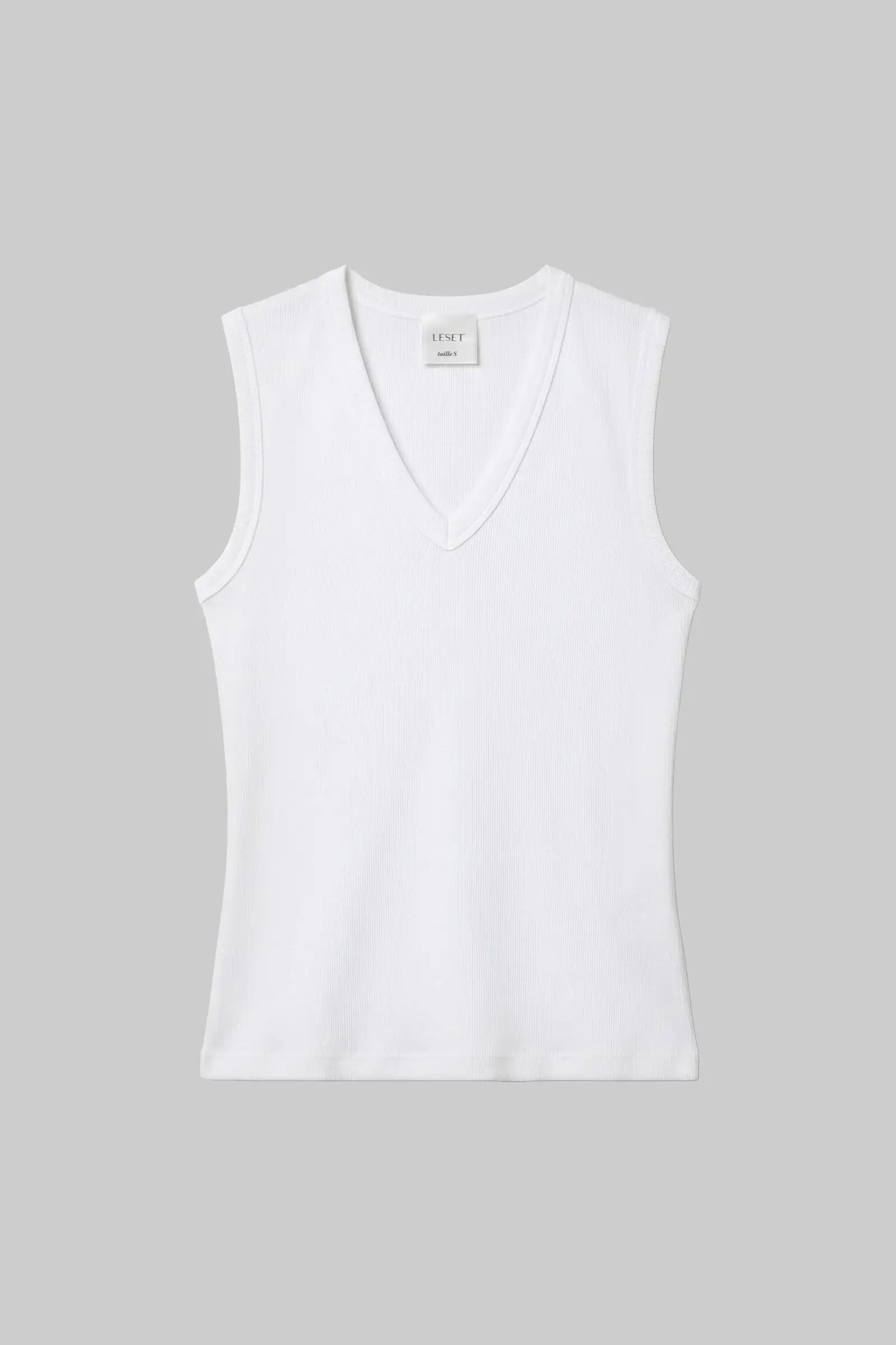 A white sleeveless V-neck tank top with a fitted silhouette, shown flat against a solid gray background.