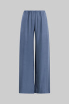 A pair of wide-leg trousers in a dusty slate blue color, shown against a solid light gray background.