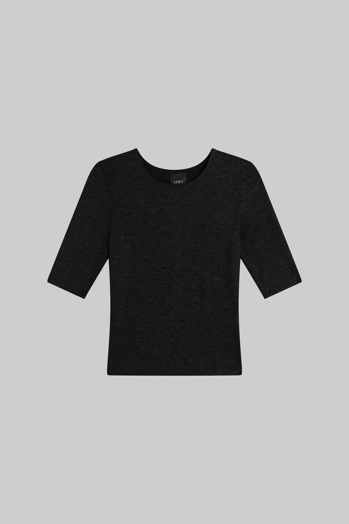 A black short-sleeve knit top with a wide crew neckline, displayed flat against a solid gray background.