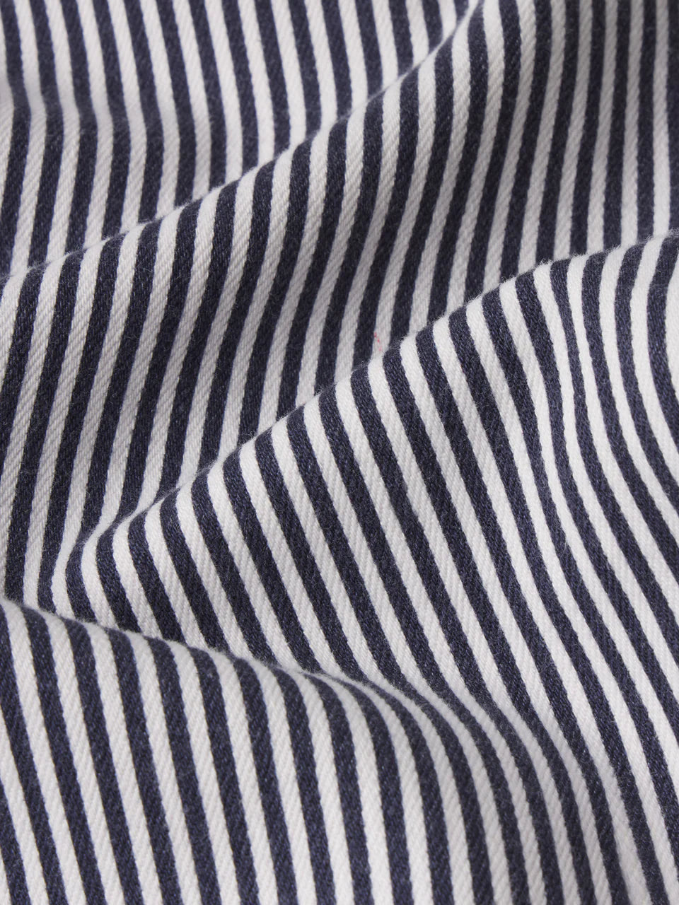 Close-up of navy and white striped fabric texture