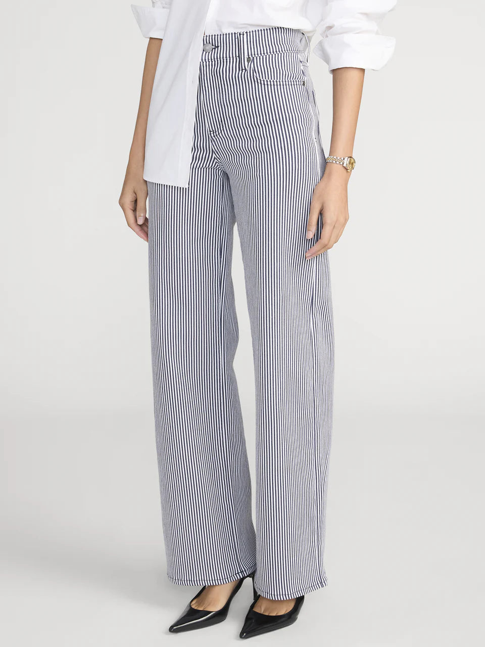 Person wearing blue and white striped pants on a white background
