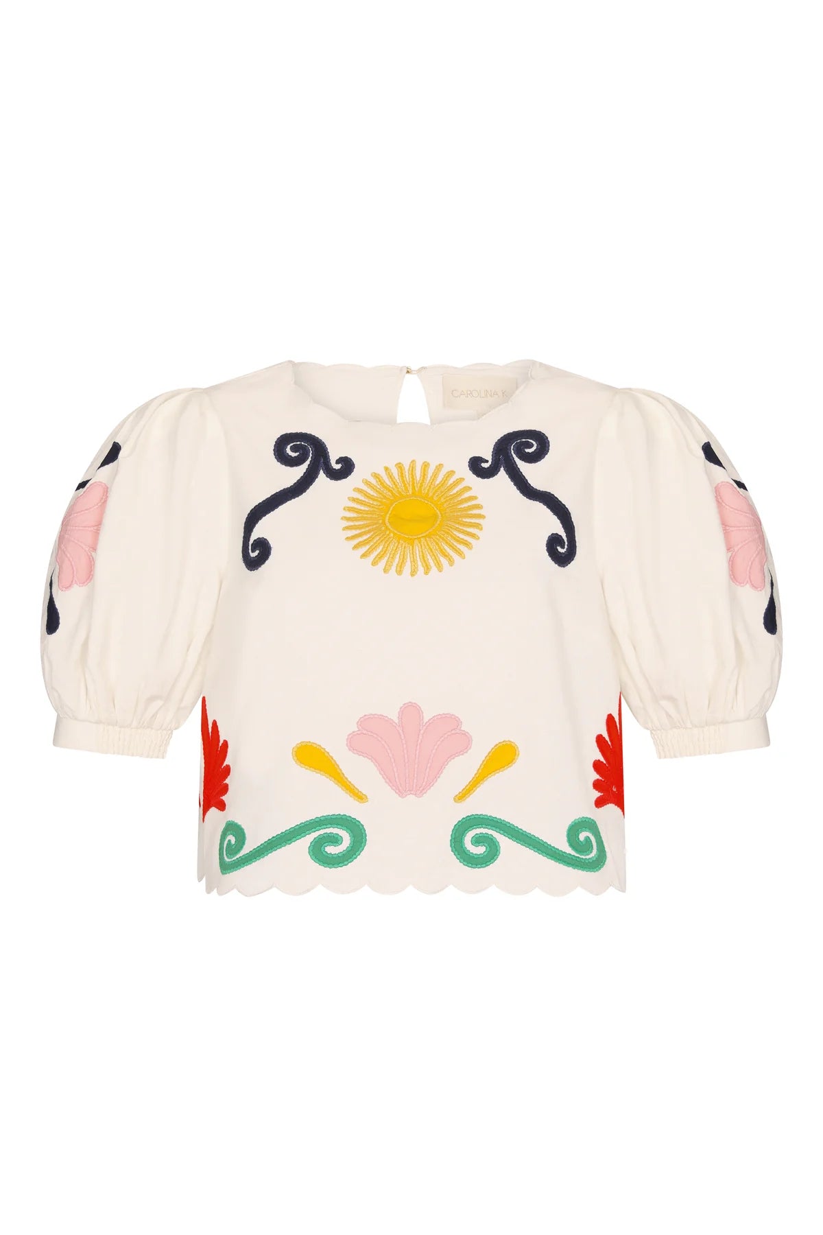 Beige blouse with colorful floral and sun design on a white background