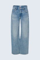 Light blue jeans on a light gray background