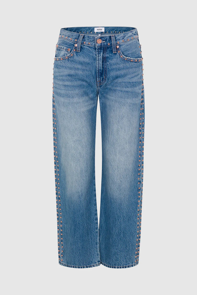Light blue denim jeans with decorative gold-tone metal studs running down the front of each leg, shown against a light gray background.