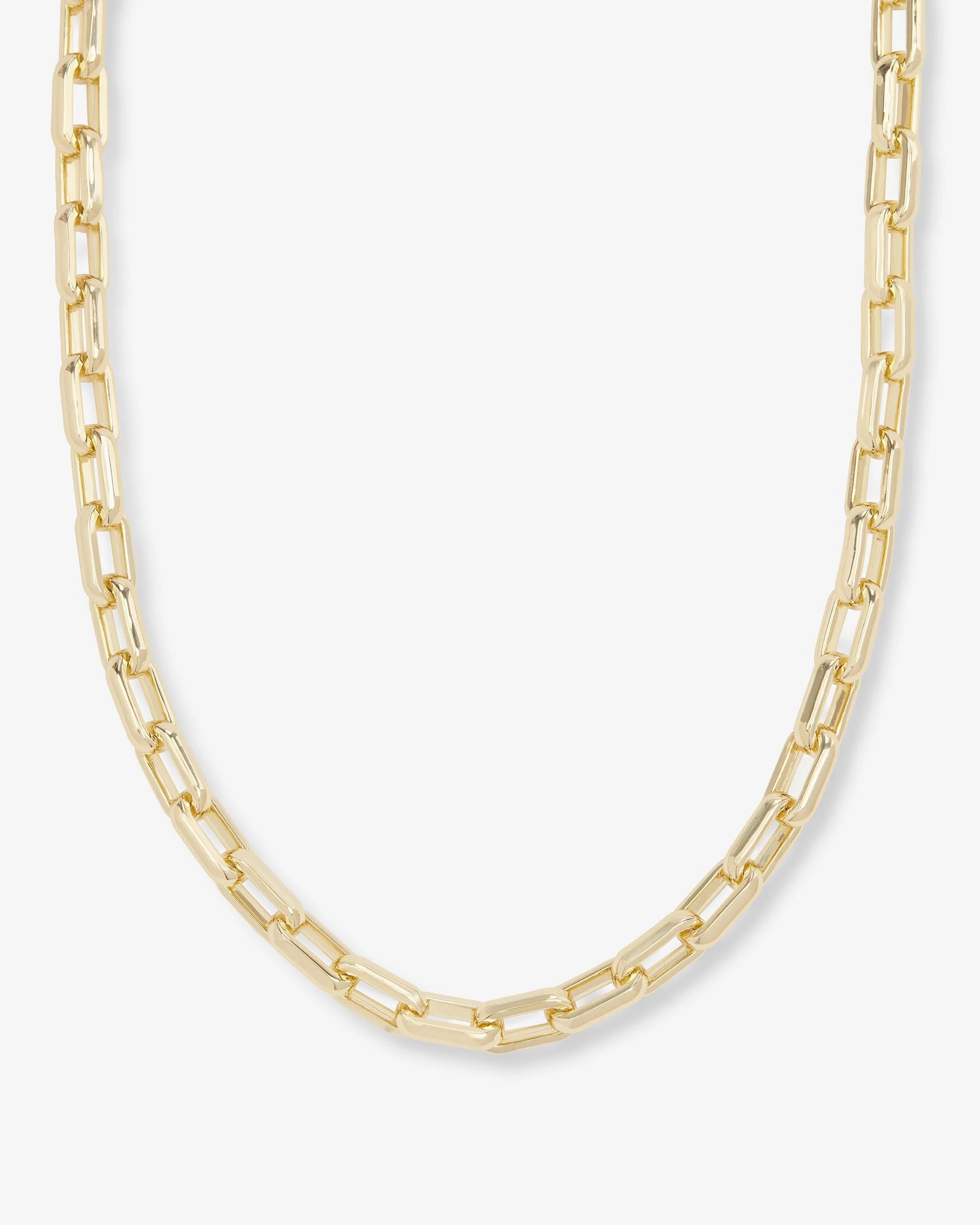 Gold chain necklace on a white background