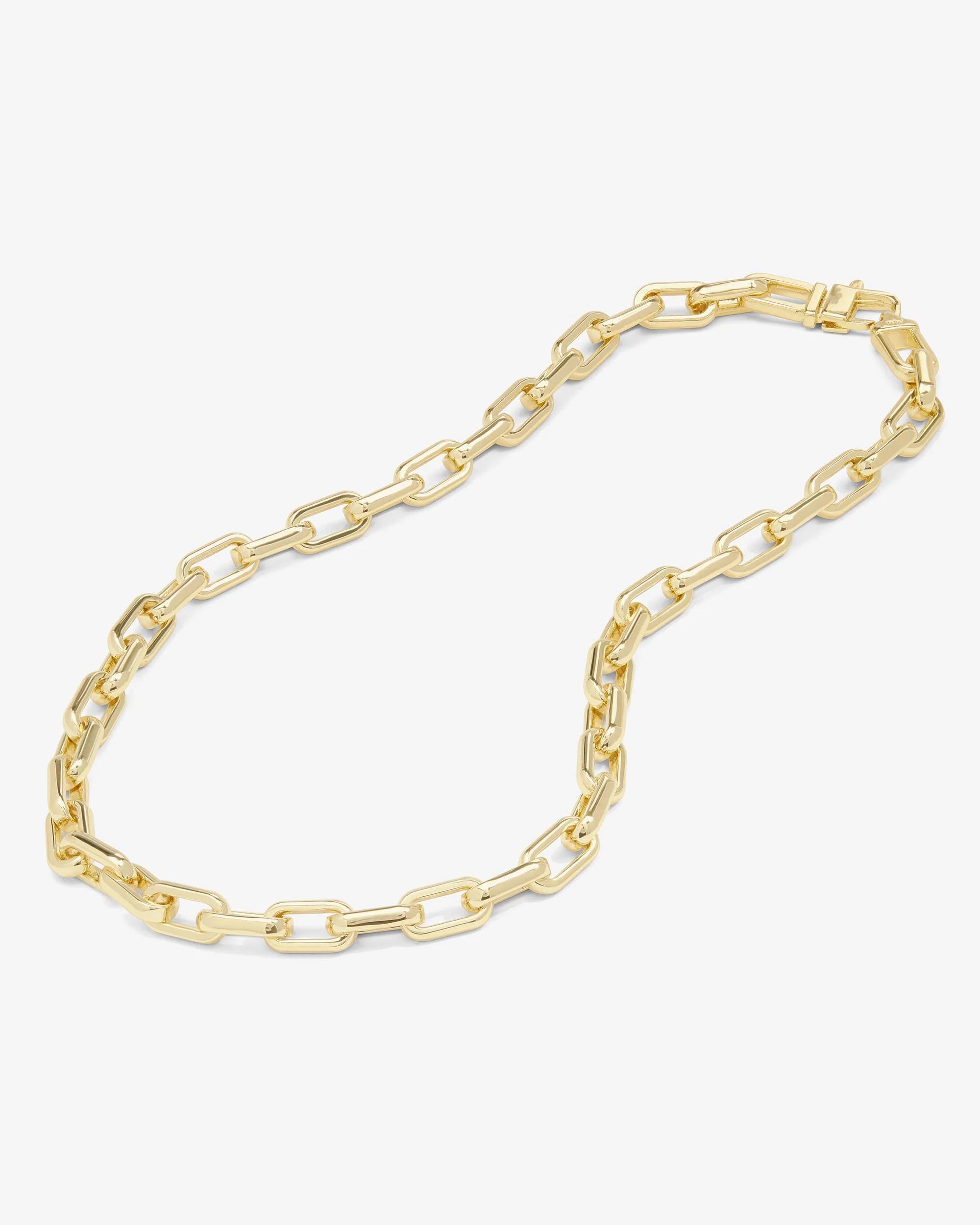 Gold chain necklace on a white background