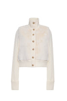 An off-white cropped cardigan featuring a fuzzy faux-fur texture across the chest and shoulders, a ribbed mock neck, button-down front with gold buttons, and ribbed cuffs and hem.