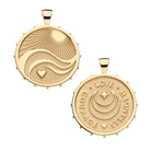 Two gold pendants on a white background