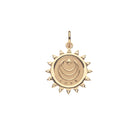 Gold pendant with celestial design on a white background