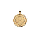 Gold pendant with a floral design on a white background