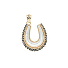 Gold pendant with black stones on a white background