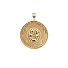 Gold pendant with intricate design on a white background
