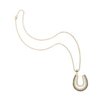 Gold necklace with a horseshoe pendant on a white background