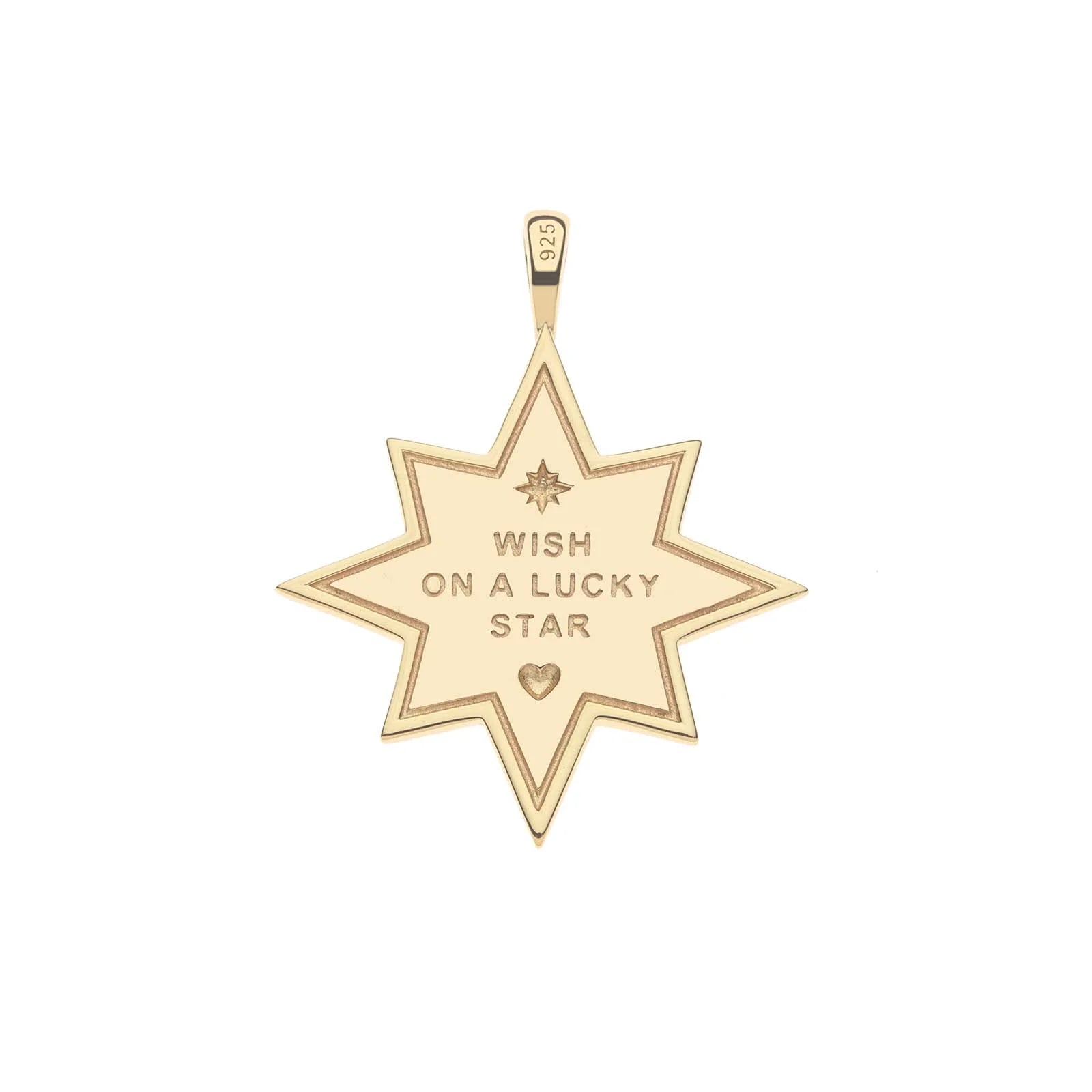 Gold pendant in the shape of an 8 pointed star with a central phrase saying wish on a lucky star and a small heart with an engraved border and diamond accents on a white background